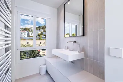 a bathroom with a sink and a window at New - sea view - splendid apartment in Nice