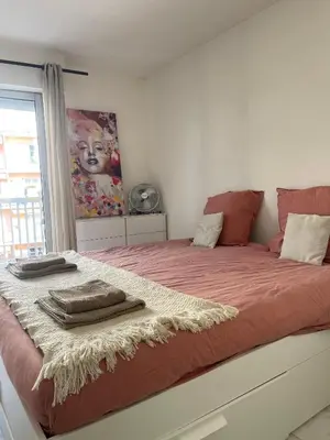 a bedroom with a bed with towels on it at apppartement avec terrasse - 2 à 4 personnes in Nice