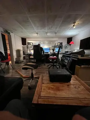 a man sitting in an office with desks and chairs at appartement maison de village in Cagnes-sur-Mer