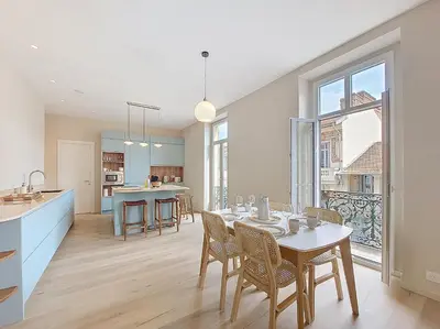 a kitchen and living room with a table and chairs at Nestor&Jeeves - PEPYTE - Design - Near Beach in Nice