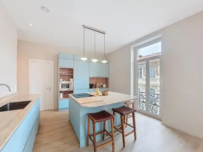 a kitchen with a island with two bar stools at Nestor&Jeeves - PEPYTE - Design - Near Beach in Nice