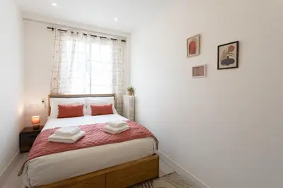a bedroom with a bed with two towels on it at L38 Hobeika Suite Fleur 7min Walk To Beach,Free Park,Balc&AC in Nice