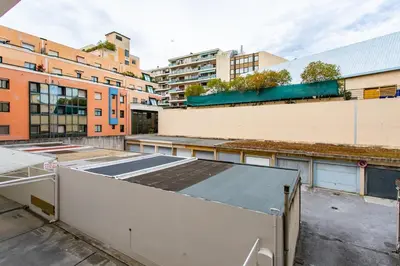 an empty parking lot with buildings in the background at L38 Hobeika Suite Fleur 7min Walk To Beach,Free Park,Balc&AC in Nice