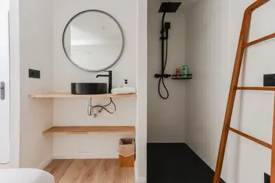 a bathroom with a mirror and a sink at Modern 3BR Duplex Near Nice Port & Old Town | By Airnest in Nice