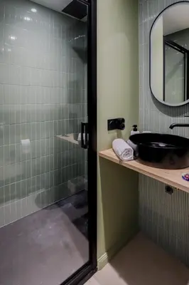 a bathroom with a sink and a shower with a mirror at Fancy 3BR Duplex Near Nice Port & Old Town | By Airnest in Nice
