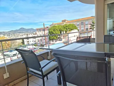 a balcony with a table and chairs and a view at Entire Condo in Nice in Nice