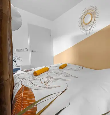 a bedroom with a bed with a design on it at Fabron studio et Résidence de Luxe avec Piscine in Nice