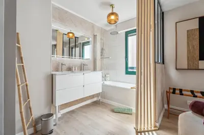 a bathroom with a tub and a sink and a mirror at Nice Renting - FLEURS - Luxury Stay Terrace Quiet Private Parking in Nice