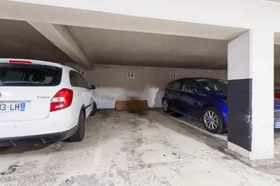 two cars are parked in a parking garage at Nice Renting - FLEURS - Luxury Stay Terrace Quiet Private Parking in Nice