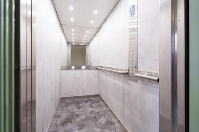 a corridor of a bathroom with a mirror at Nice Renting - FLEURS - Luxury Stay Terrace Quiet Private Parking in Nice
