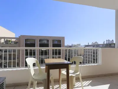 a table and chairs on a balcony with a view at Apartment Baie Azur by Interhome in Nice