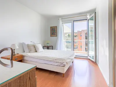 a bedroom with a bed and a large window at Apartment Baie Azur by Interhome in Nice