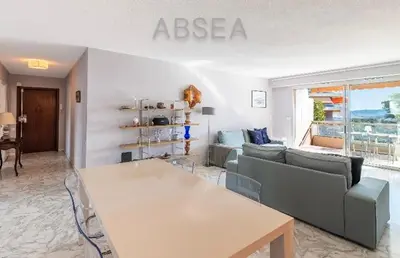 a living room with a couch and a table at Nice Absea Belles Terres A in Nice