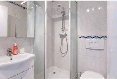 a bathroom with a shower and a toilet and a sink at Nice Absea Belles Terres A in Nice