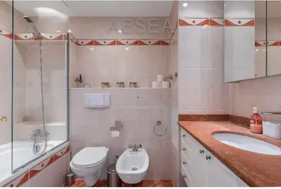 a bathroom with a toilet and a sink and a tub at Nice Absea Belles Terres A in Nice
