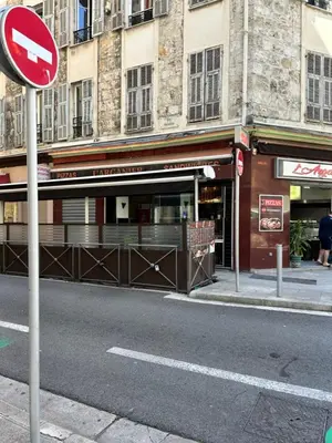 a street sign in front of a building at City Center Studio - 1 min Train Station & Main Street in Nice