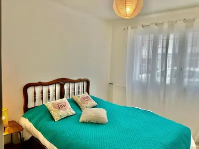 a bedroom with a bed with two pillows on it at Les Bleuets in Cagnes-sur-Mer