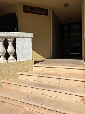 a set of stairs in front of a building at Agréable appartement à Beaulieu sur mer à 300 métres des commerces et de la mer in Beaulieu-sur-Mer