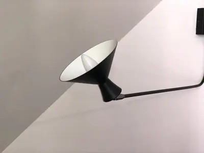 a black and white lamp hanging from a ceiling at Apartment Port in Nice