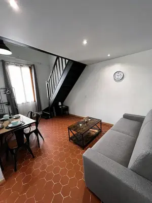 a living room with a couch and a table at Central Super Loft in Nice