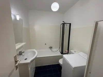 a bathroom with a sink and a toilet and a shower at Cozy Apt with balcony - Garibaldi Port in Nice