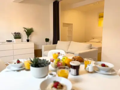 a room with a table with fruit on it at Charmant 2 pièces proche mer in Nice