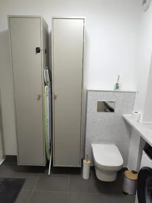 a white bathroom with a toilet and a shower at Studio calme et paisible, climatisé avec terrasse au dernier étage, 100m du tramway et 20 min de la promenade des anglais in Nice