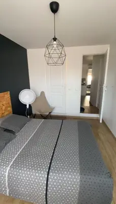a bedroom with a large bed in a room at Appartement de 4 chambres proche plage, tram et aeroport in Nice