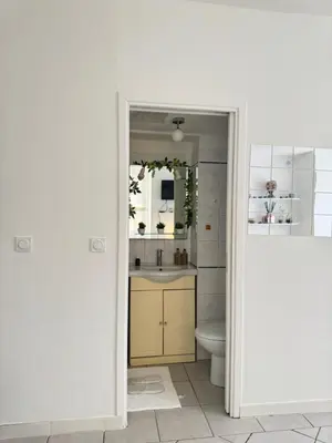 a bathroom with a toilet and a sink at Cozy studio sur la promenade in Nice