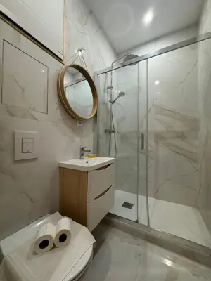 a bathroom with a shower and a toilet and a sink at Charming Studio in the Heart of Nice in Nice