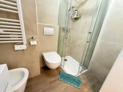 a bathroom with a shower and a toilet and a sink at Azur Promenade in Nice