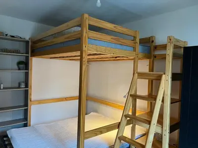 a bunk bed with a ladder in a room at Studio tout équipé in Nice