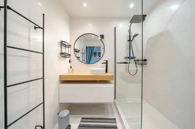 a bathroom with a sink and a mirror at Panoramic sea view of the French Riviera, Parking in Nice