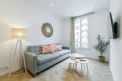 a living room with a couch and a table at Large & Confort 2 Bdr Renovated in Nice