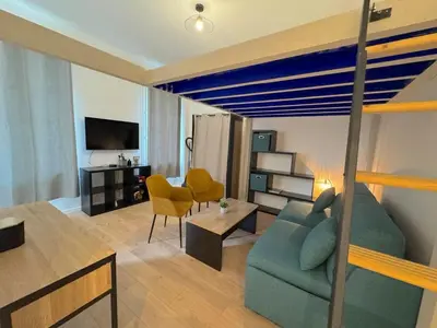 a small room with a bed and a table at ⁂Appartement élégant plage à 100m prom des anglais in Nice