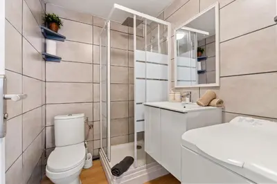 a bathroom with a toilet and a sink and a mirror at Nice Renting - CLEMENCEAU - Riviera Cocoon Calm Elegance Design in Nice