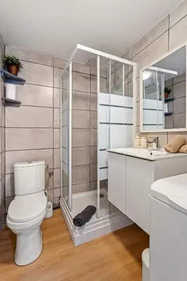 a bathroom with a toilet and a sink and a shower at Nice Renting - CLEMENCEAU - Riviera Cocoon Calm Elegance Design in Nice