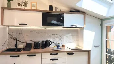 a kitchen with white cabinets and a counter top at Ze Perfect Place - Magnifique Studio Vieux Nice in Nice