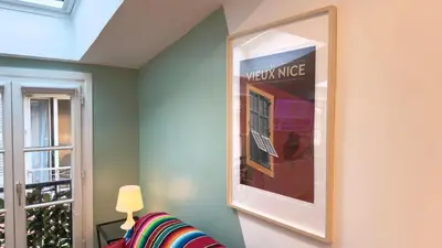 a mirror on a wall with a picture on it at Ze Perfect Place - Magnifique Studio Vieux Nice in Nice