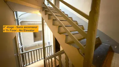 a stairs in a building with a sign on it at Ze Perfect Place - Magnifique Studio Vieux Nice in Nice