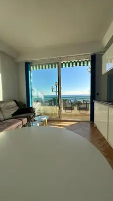 a living room with a view of the ocean at Carre d Or Face a la Mer in Nice