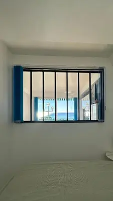a room with a large window in a white wall at Carre d Or Face a la Mer in Nice