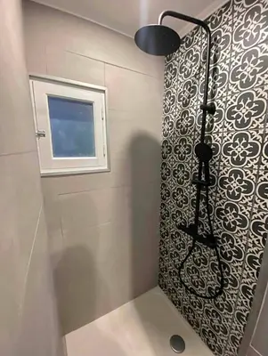 a shower in a bathroom with a window at Nice centre studio rénové avec emplacement central in Nice