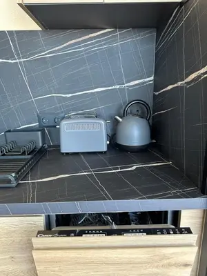 a tea kettle sitting on top of a stove at Casa Monaco - Costa plana résidence in Cap d'Ail