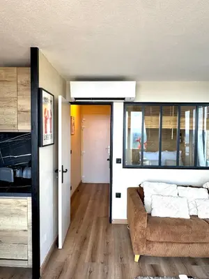a bedroom with a bed and a couch in a room at Casa Monaco - Costa plana résidence in Cap d'Ail