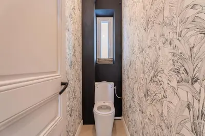 a bathroom with a toilet and a mirror at Charme et confort - centre ville de Nice in Nice