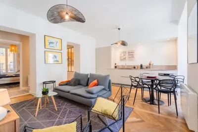a living room with a couch and a table at Charme et confort - centre ville de Nice in Nice