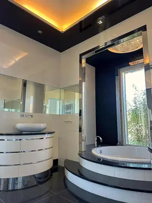 a bathroom with a tub and a large mirror at Luxury Villa Pool & Sea View in Nice