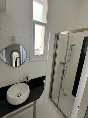 a bathroom with a sink and a mirror at Luxury Villa Pool & Sea View in Nice