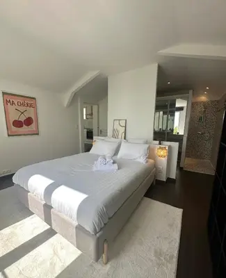 a large white bed with a stuffed animal on it at Luxury Villa Pool & Sea View in Nice